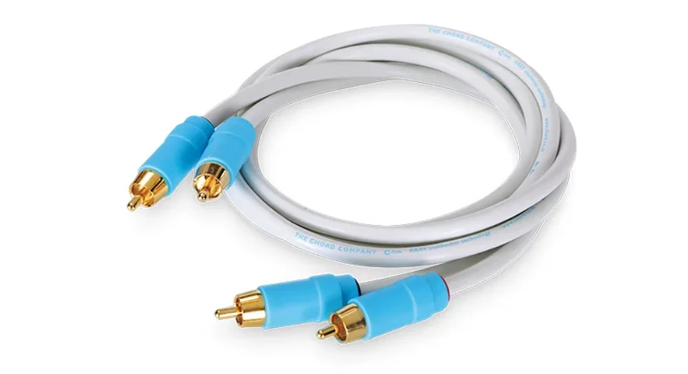 White audio cable with gold-plated RCA connectors and blue sleeves, coiled neatly. For soundhub's blog Best  Audio Accessories.
